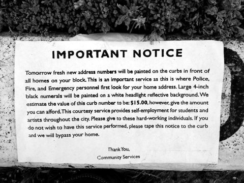 A printed 'important notice' scam flyer asking residents for money