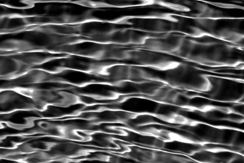 Rippling blue water in a swimming pool