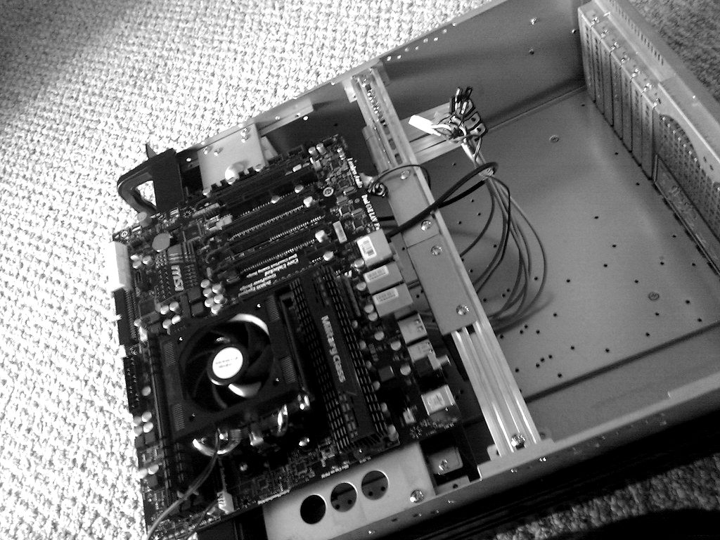 A computer motherboard inside an open case
