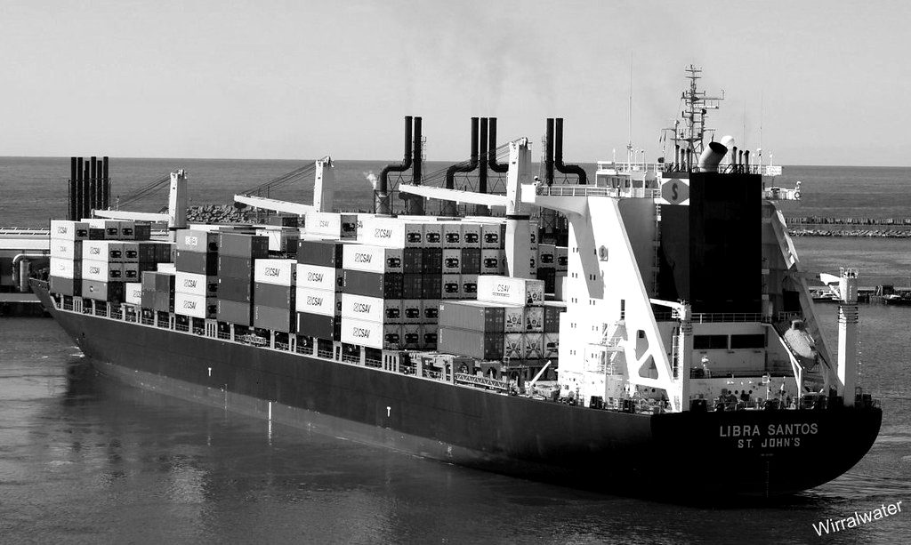 A container ship loaded with cargo leaving port