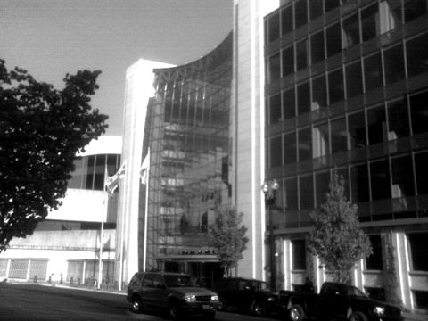 A modern glass government office building in Washington, DC