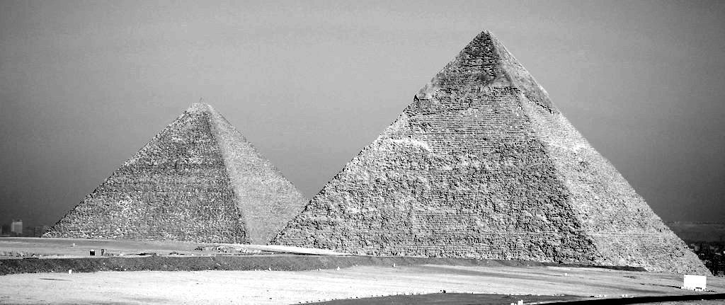 Two of the pyramids of Giza in warm evening light