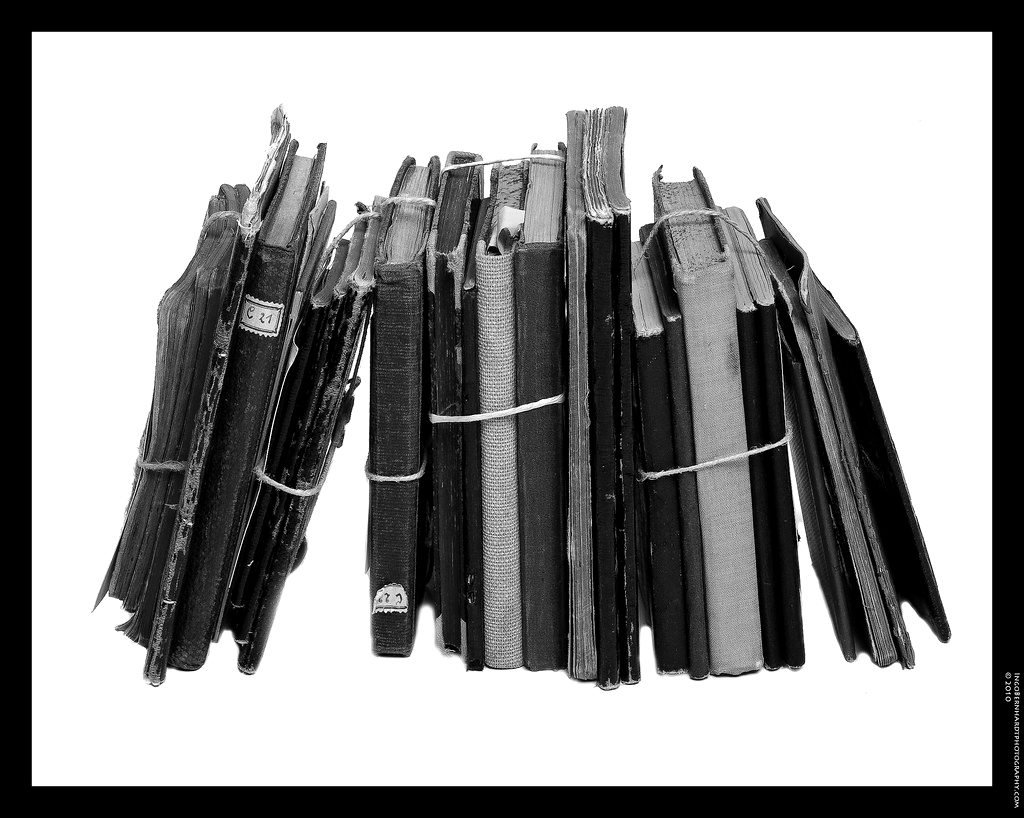 A row of worn pocket notebooks
