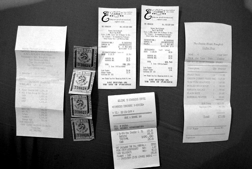 Shop receipts laid out on a blue cloth