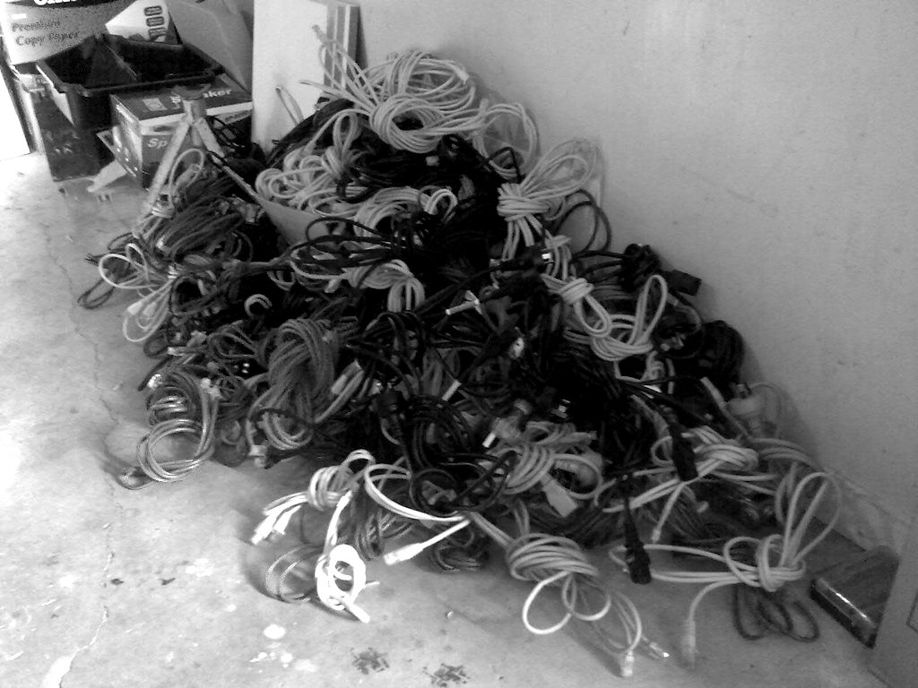 A tangle of network cables piled on the floor
